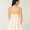 Mini abito babydoll senza spalline con volant