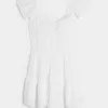 Mini abito gonna-pantalone con maniche a sbuffo e busto a pizzico