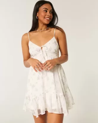 Mini abito in chiffon con orlo asimmetrico