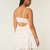 Mini abito in chiffon con orlo asimmetrico