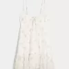 Mini abito in chiffon con orlo asimmetrico