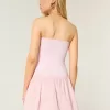 Mini abito in maglia senza spalline con vita bassa
