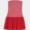 Mini abito in maglia senza spalline con vita bassa