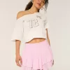 Mini gonna pantalone a strati con orlo asimmetrico