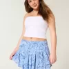 Mini gonna pantalone a strati con orlo asimmetrico