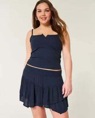 Mini gonna pantalone a strati con orlo asimmetrico
