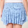 Mini gonna pantalone a strati con orlo asimmetrico