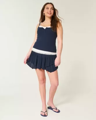 Mini gonna pantalone a strati con orlo asimmetrico