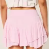 Mini gonna pantalone a strati con orlo asimmetrico