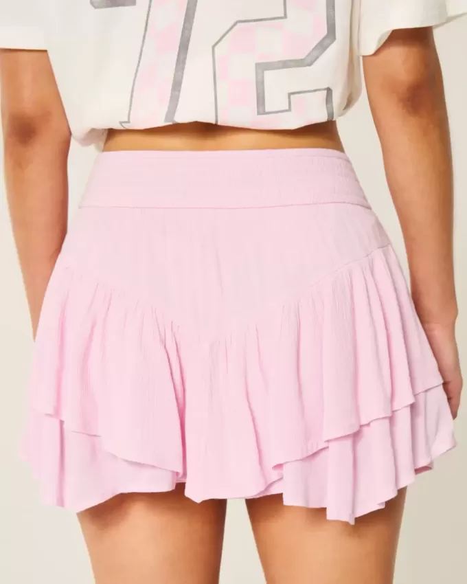 Mini gonna pantalone a strati con orlo asimmetrico