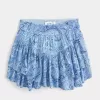 Mini gonna pantalone a strati con orlo asimmetrico