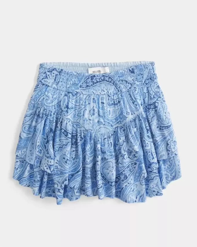 Mini gonna pantalone a strati con orlo asimmetrico