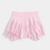 Mini gonna pantalone a strati con orlo asimmetrico