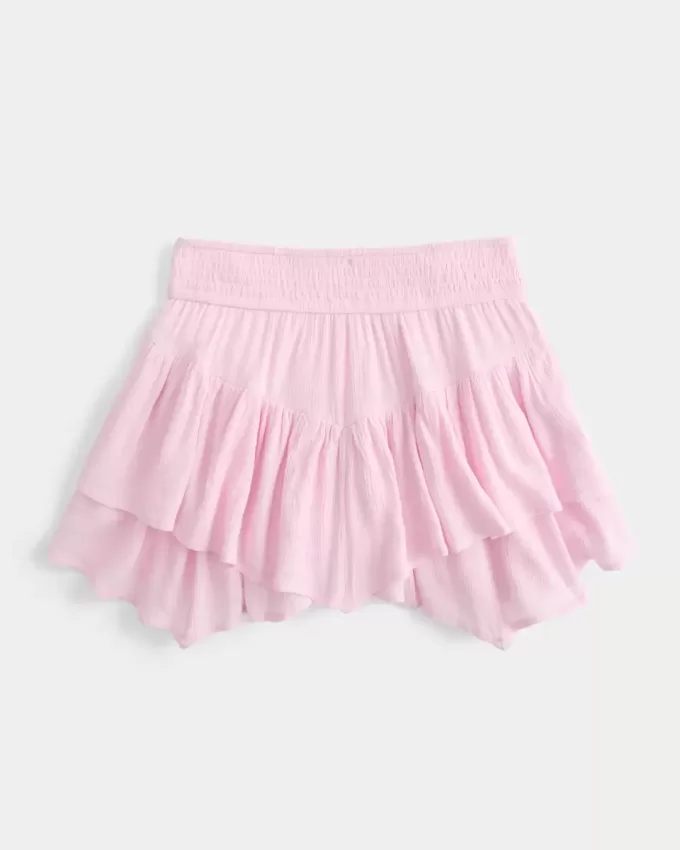 Mini gonna pantalone a strati con orlo asimmetrico