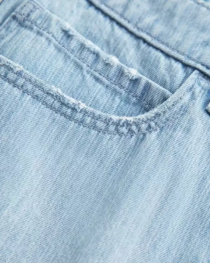 Mini gonna-pantalone in denim a righe a vita bassa
