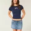 Mini gonna-pantalone in denim a vita bassa con fiocco ricamato