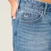 Mini gonna-pantalone in denim a vita bassa con fiocco ricamato