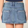 Mini gonna-pantalone in denim a vita bassa con fiocco ricamato