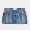 Mini gonna-pantalone in denim a vita bassa con fiocco ricamato