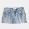 Mini gonna-pantalone in denim a vita bassa con stelle ricamate