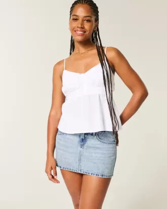 Mini gonna-pantalone in denim a vita bassa e sinuosa