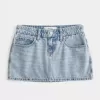 Mini gonna-pantalone in denim a vita bassa e sinuosa