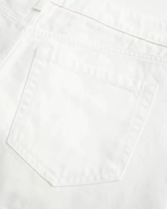 Mini gonna-pantalone in denim bianco a vita bassa