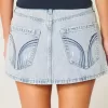 Mini gonna-pantalone in denim chiaro a vita bassa