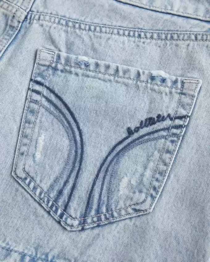 Mini gonna-pantalone in denim chiaro a vita bassa
