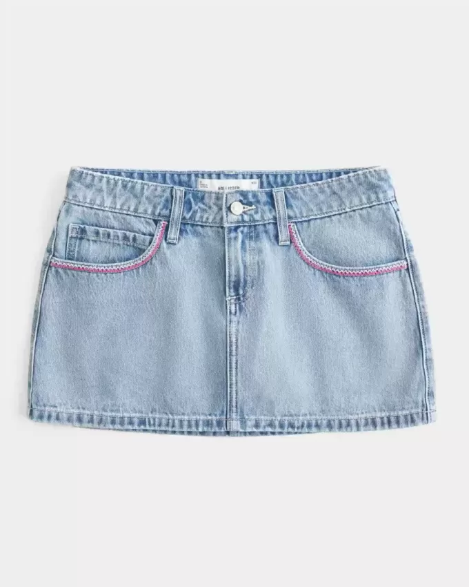 Mini gonna-pantalone in denim chiaro ricamato rosa a vita bassa