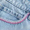 Mini gonna-pantalone in denim chiaro ricamato rosa a vita bassa