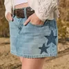 Mini gonna-pantalone in denim con applicazione a stella e lavaggio medio a vita bassa