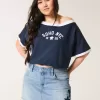 Mini gonna-pantalone in denim con applicazione a stella e lavaggio medio a vita bassa