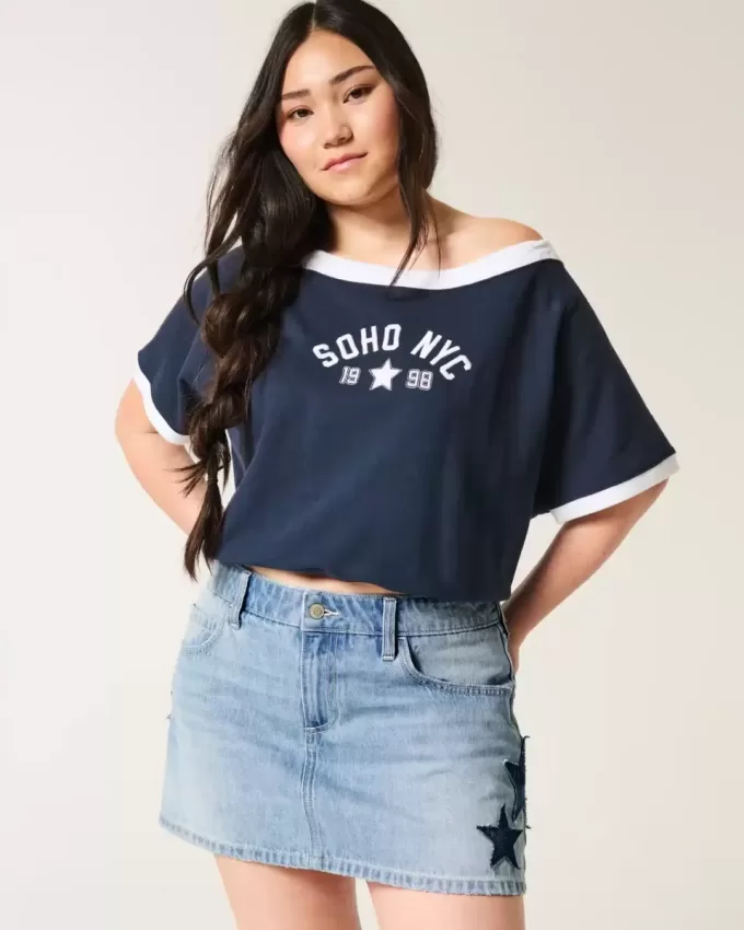 Mini gonna-pantalone in denim con applicazione a stella e lavaggio medio a vita bassa
