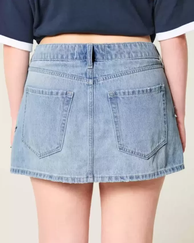 Mini gonna-pantalone in denim con applicazione a stella e lavaggio medio a vita bassa