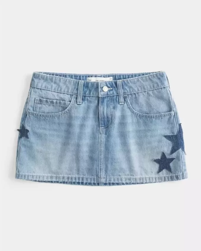 Mini gonna-pantalone in denim con applicazione a stella e lavaggio medio a vita bassa