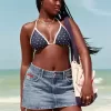 Mini gonna-pantalone in denim con bandiera ricamata e lavaggio medio a vita bassa