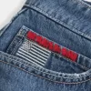 Mini gonna-pantalone in denim con bandiera ricamata e lavaggio medio a vita bassa