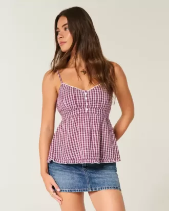 Mini gonna-pantalone in denim con borchie a vita bassa
