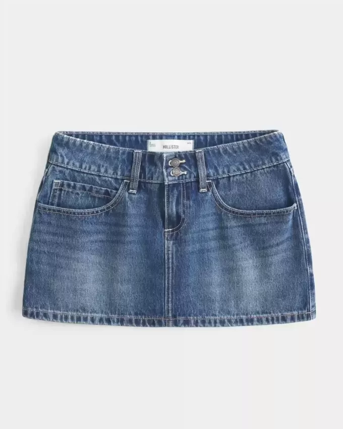 Mini gonna-pantalone in denim con borchie a vita bassa
