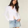 Mini gonna-pantalone in denim con borchie lavaggio chiaro