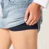Mini gonna-pantalone in denim con borchie lavaggio chiaro