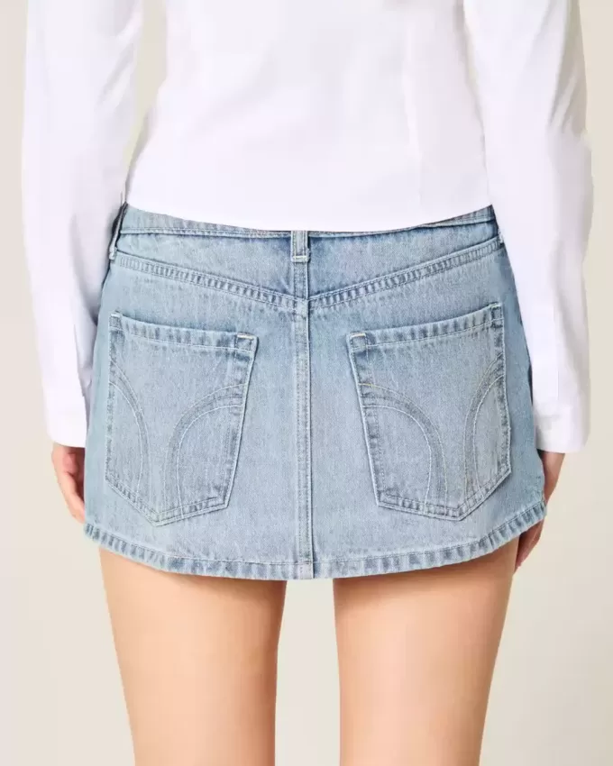 Mini gonna-pantalone in denim con borchie lavaggio chiaro