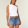 Mini gonna-pantalone in denim con fiocco ricamato a vita bassa e sinuosa