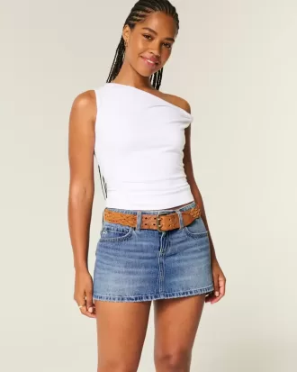 Mini gonna-pantalone in denim con fiocco ricamato a vita bassa e sinuosa