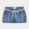 Mini gonna-pantalone in denim con lacci in pizzo
