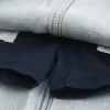 Mini gonna-pantalone in denim con lacci lavaggio chiaro