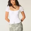 Mini gonna-pantalone in denim mimetico a vita bassa e sinuosa