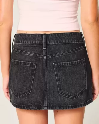 Mini gonna-pantalone in denim nero lavato a vita bassa