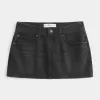 Mini gonna-pantalone in denim nero lavato a vita bassa